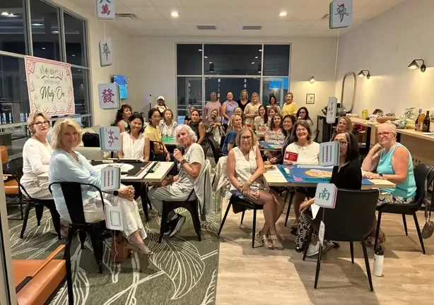 A group gathered in the club lounge after an event